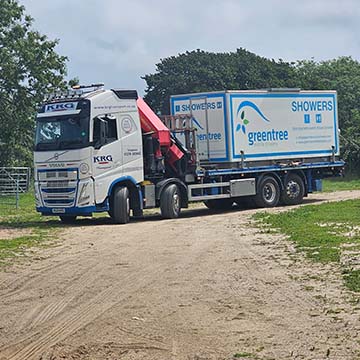 lorry with mobile shower blocks on board